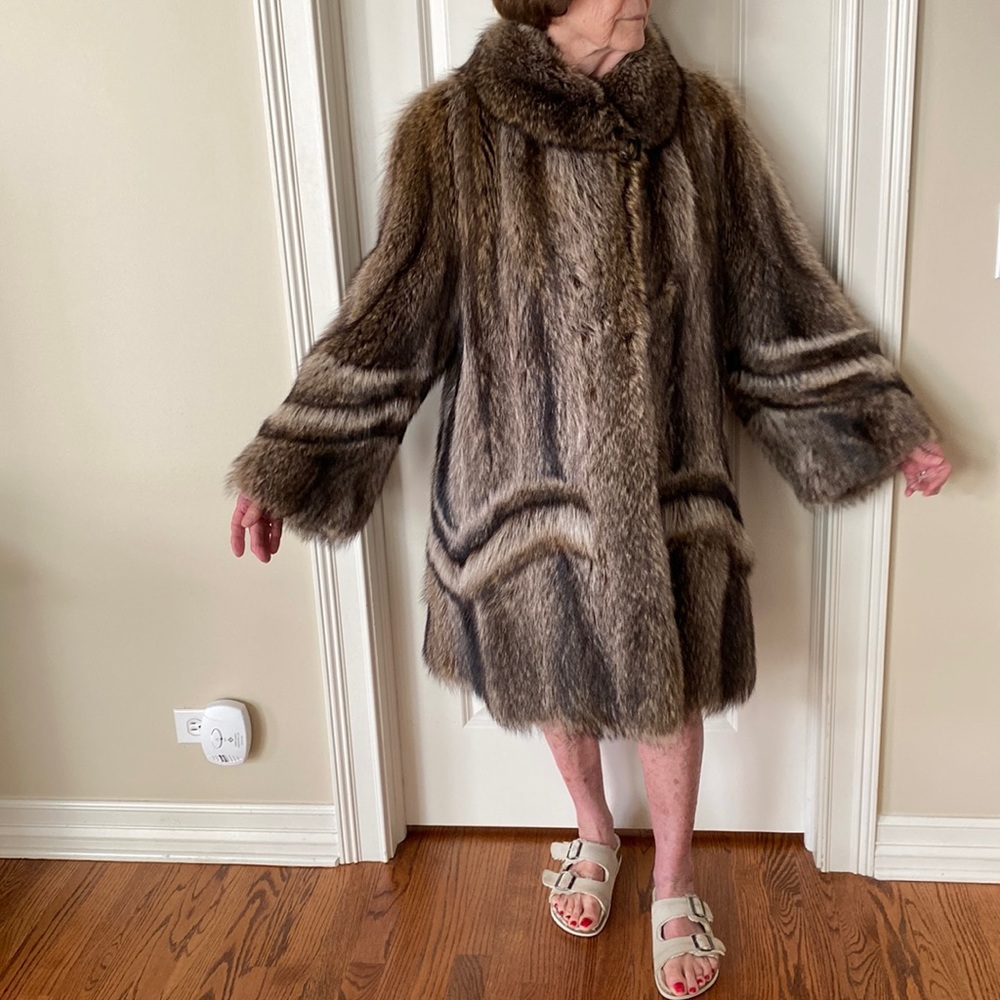 Knee length women’s raccoon coat